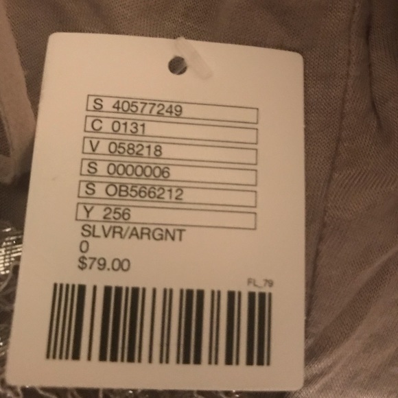 It’s a silver jumpsuit party dress 👗. - Picture 3 of 4